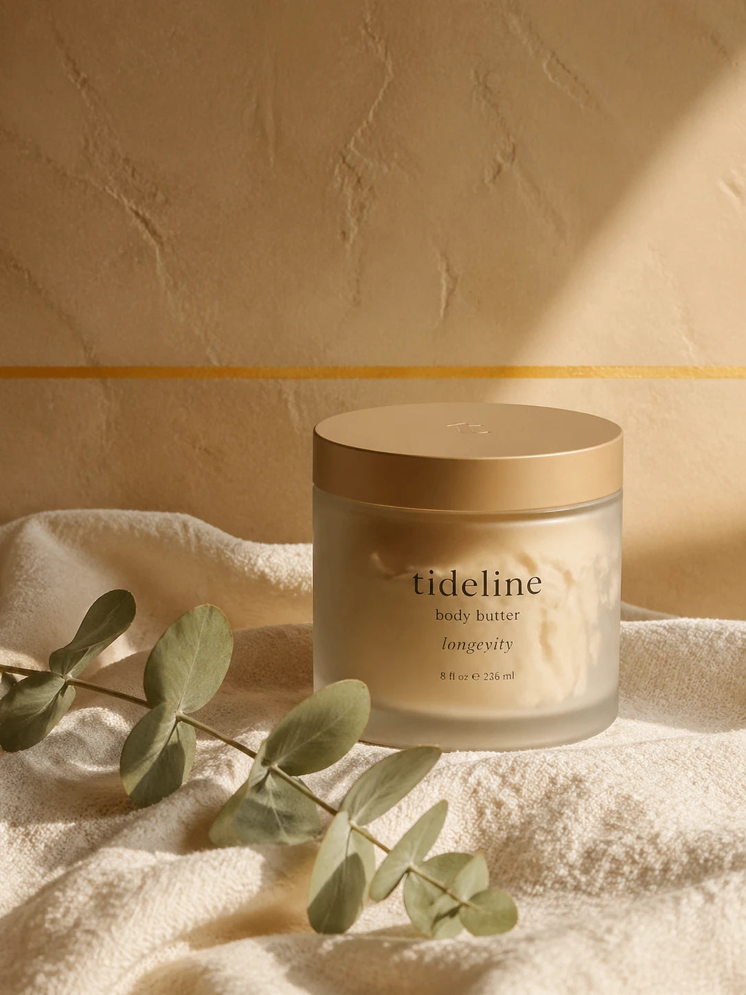 Warm-stone-camel Tideline daily butter jar on linen with eucalyptus, saffron horizon