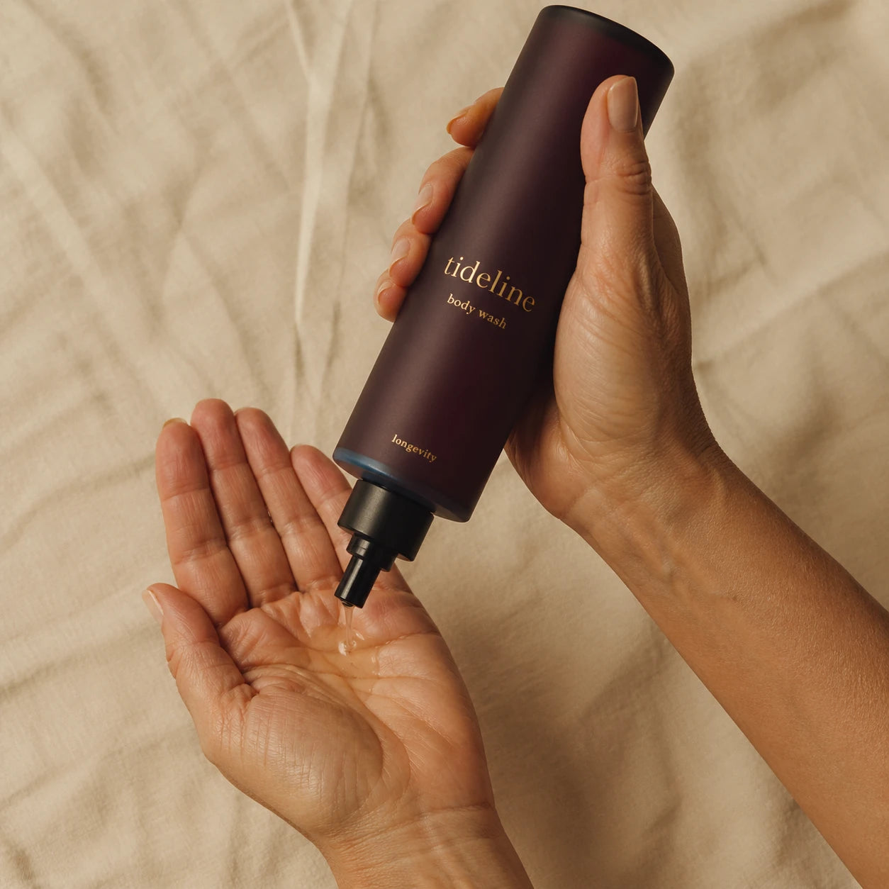 Hand pouring daily wash into open palm